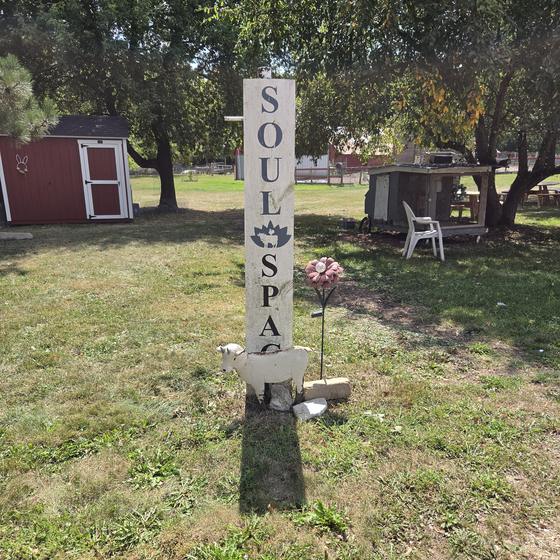 The SoulSpace sign post on the sanctuary lawn